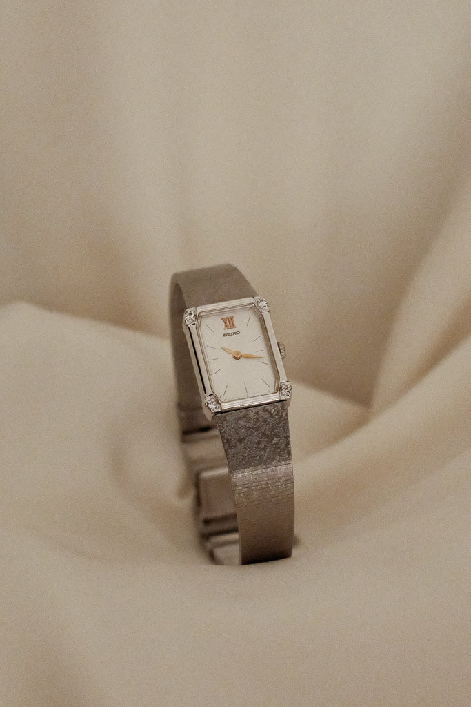 Vintage Seiko Ladies Silver Watch with Gold Hands and Gems on Bezel