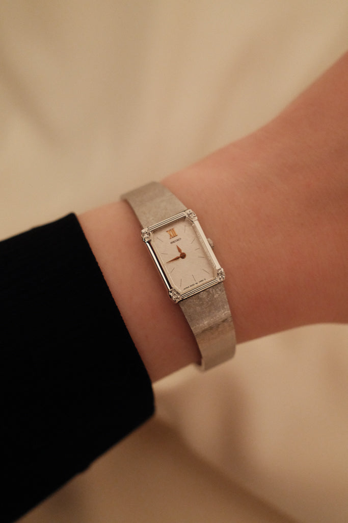 Vintage Seiko Ladies Silver Watch with Gold Hands and Gems on Bezel