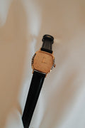 Vintage Seiko Ladies Gold Hexagonal Watch with Gemstones on Black Leather Strap