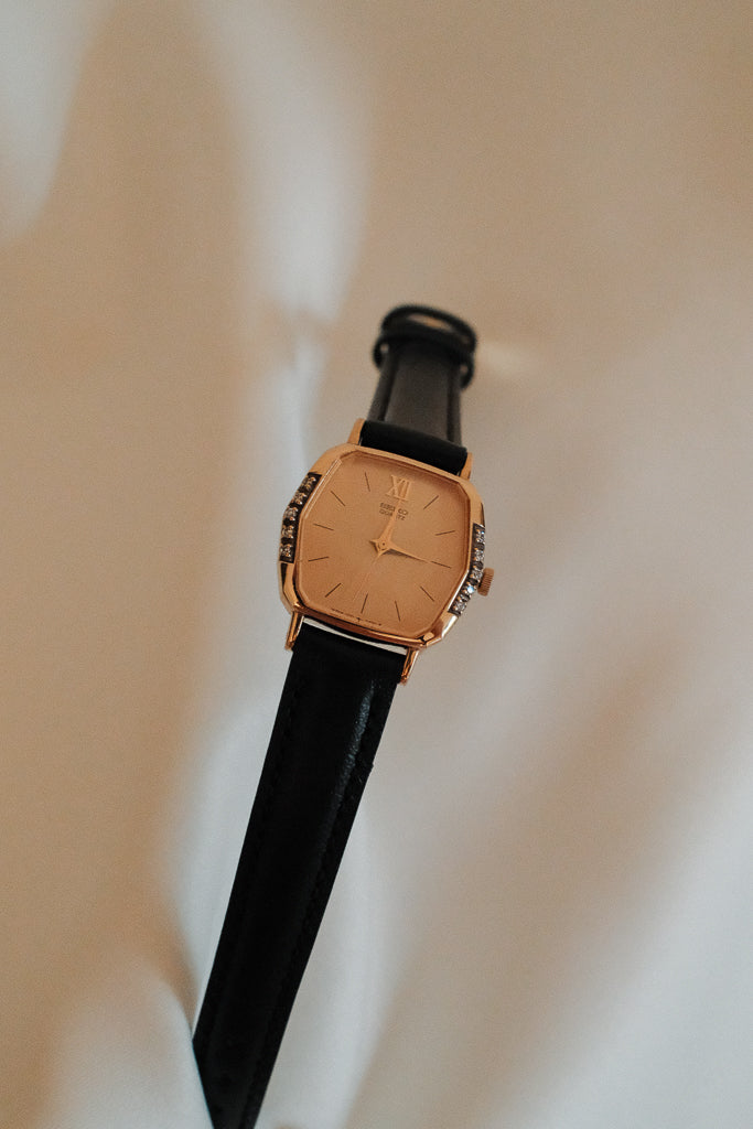 Vintage Seiko Ladies Gold Hexagonal Watch with Gemstones on Black Leather Strap