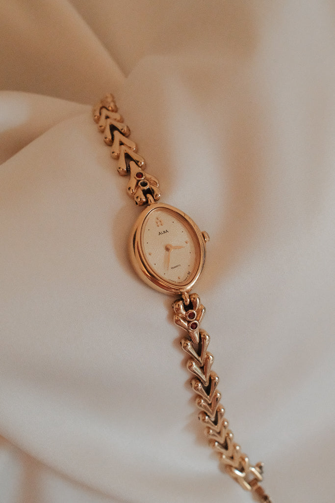Vintage Alba Ladies Gold Watch with Red Gemstone