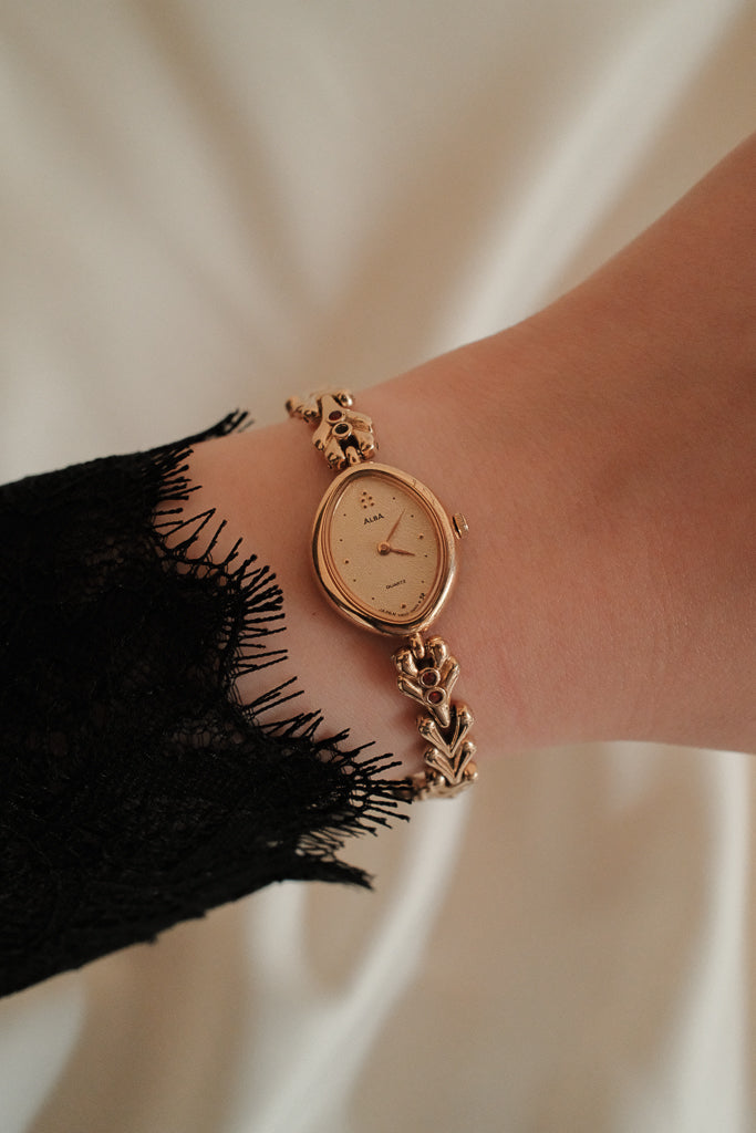 Vintage Alba Ladies Gold Watch with Red Gemstone