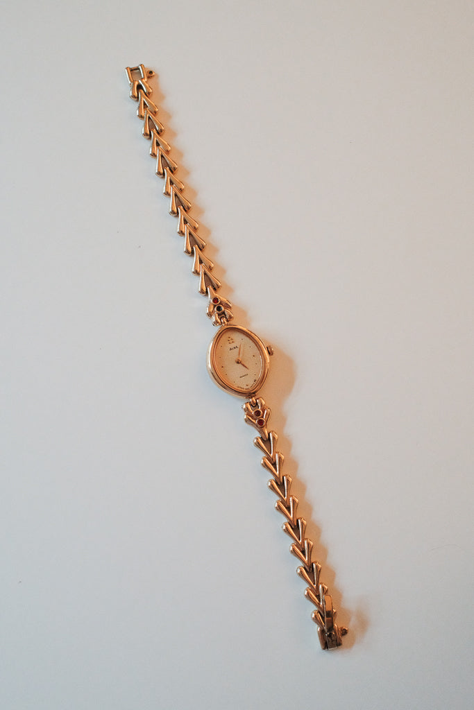 Vintage Alba Ladies Gold Watch with Red Gemstone