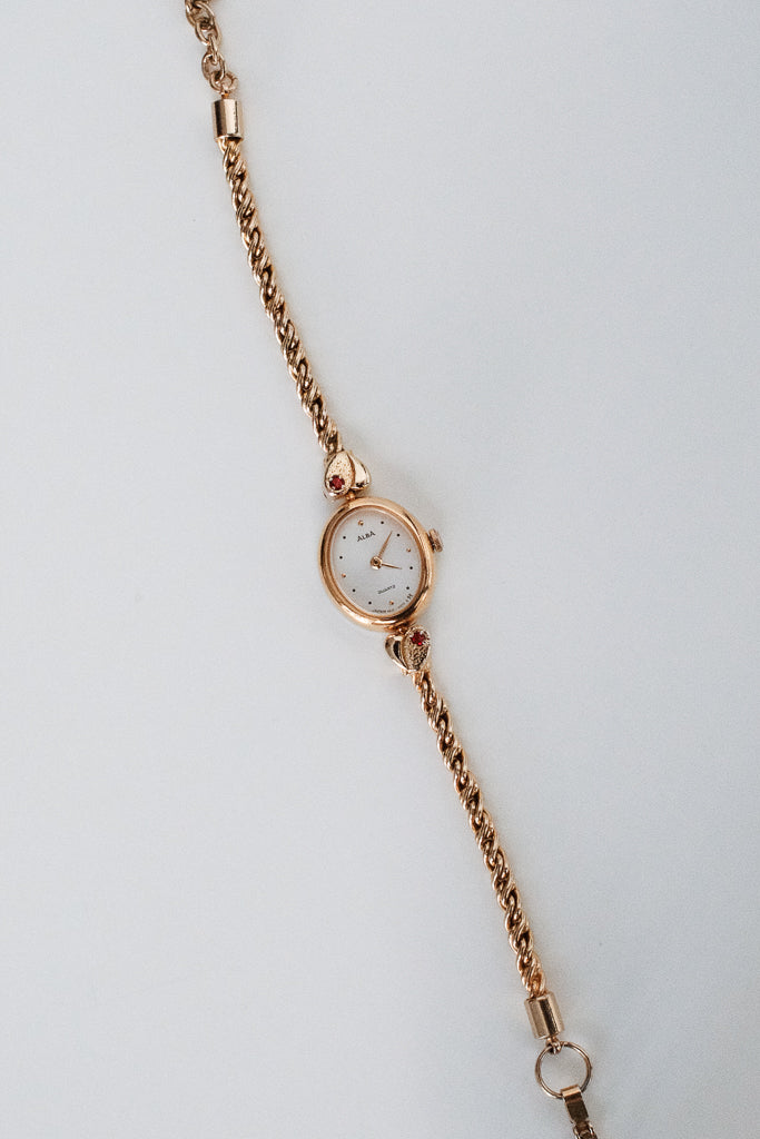 Vintage Alba Ladies Gold Heart Bracelet Watch with Red Gemstones