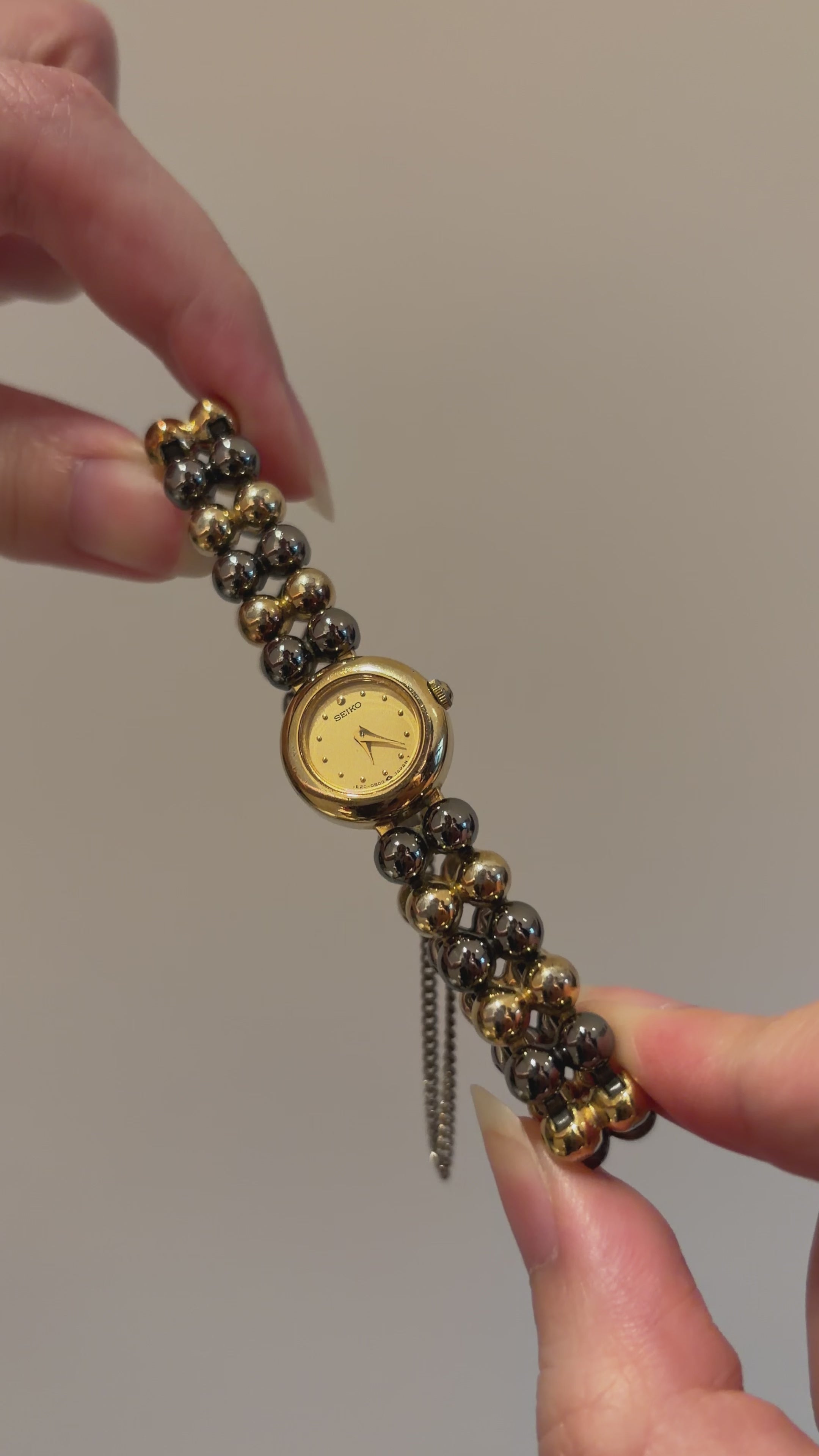 Vintage Seiko Ladies Petite Mixed Gold and Gunmetal Watch with Gold Dial