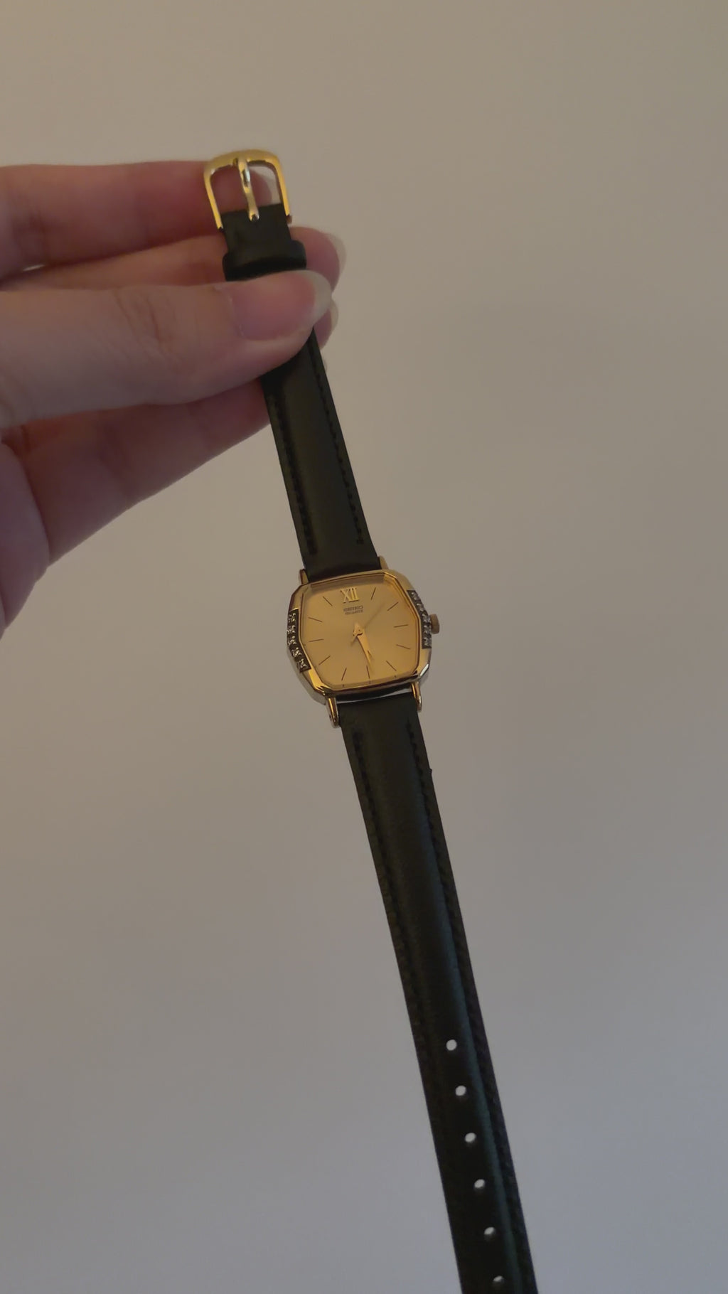 Vintage Seiko Ladies Gold Hexagonal Watch with Gemstones on Black Leather Strap