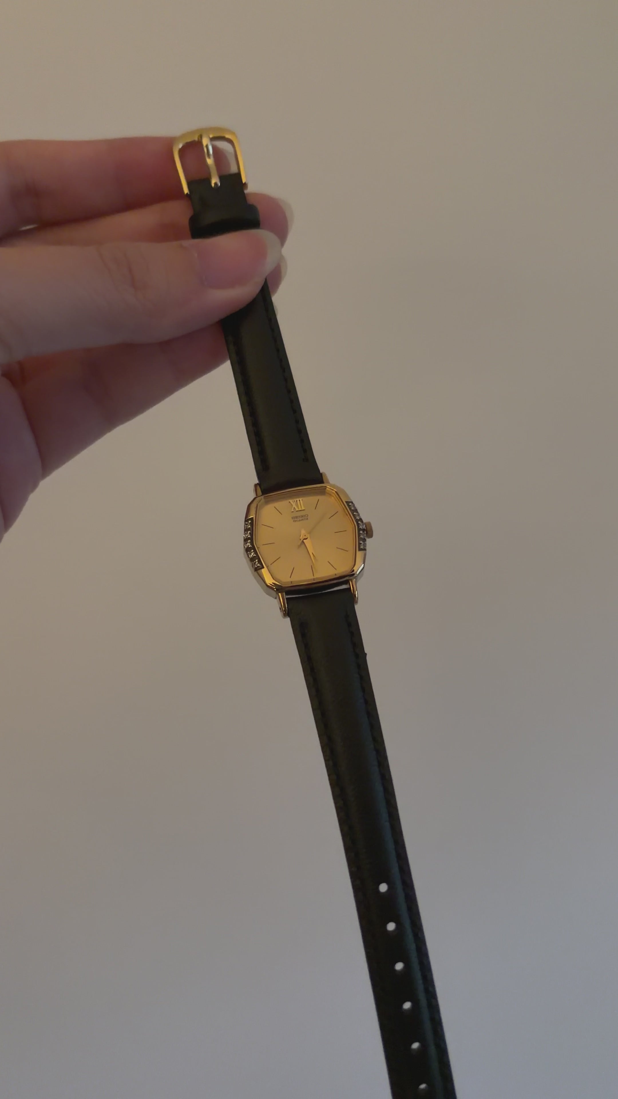 Vintage Seiko Ladies Gold Hexagonal Watch with Gemstones on Black Leather Strap